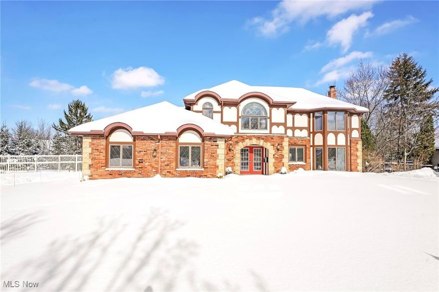 Welcome to 10510 Tudor Cir in N Royalton, a home full of character & generous living space. This 4-bedroom, 3.5-bath property offers an inviting exterior with ample curb appeal & a setting that feels like a private retreat. The backyard features 2 ponds with waterfalls, a large open yard, & a spacious rear porch, creating an ideal backdrop for outdoor entertaining, quiet mornings, or evening gatherings. The walk-out basement opens directly to this scenic outdoor area, making indoor & outdoor living feel seamlessly connected. Inside, the home is charming & well maintained, offering an excellent opportunity to personalize over time. A warm living room with a fireplace & built-in bookshelves welcome you into the home. The kitchen is a true centerpiece of the home, featuring abundant counter space, generous cabinetry, & a layout designed for both everyday living & hosting. It flows naturally into the sun-drenched dining room, where oversized windows bring in natural light & overlook the backyard, creating a bright & inviting space for meals & gatherings. Whether preparing dinner or entertaining guests, the kitchen & dining area work together as a functional & welcoming hub of the home. The 1st floor also includes an office & a convenient laundry room. The spacious primary suite serves as a private retreat with an en-suite bathroom featuring a large soaking tub & separate shower. The additional bedrooms are well sized & share a full bathroom on the upper level. The lower level provides exceptional flexibility with a large open area ideal for a home gym or secondary living space, a full bathroom, & two bonus rooms perfect for an office, craft room, or hobby area. A former two-car garage has been converted into a dance studio, leaving a one-car garage while adding a unique & functional space. With its distinctive features, inviting kitchen & dining spaces, & tranquil outdoor setting, this home offers charm, flexibility, & opportunity in a desirable N Royalton neighborhood.