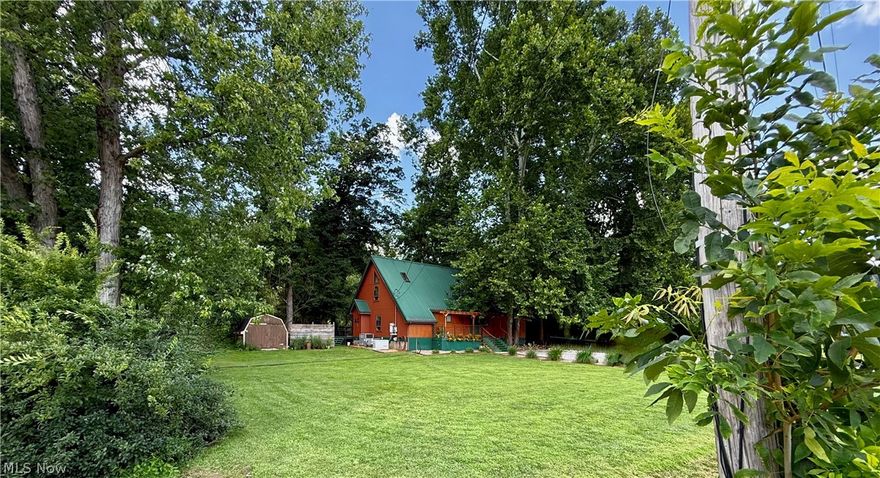 Imagine waking each morning to the quiet rhythm of the river, coffee in hand, watching the sunlight dance across the water. Welcome to your own private riverfront retreat on nearly 2 acres where life slows down and every day feels a little like vacation. This beautiful home offers approximately 1,800 square feet of living space and is being sold *fully furnished*, making it ideal as a turnkey Airbnb opportunity or the perfect place to enjoy river life all to yourself. Step inside and you’ll immediately notice the quality and character throughout. Soaring ceilings, hardwood floors, solid wood doors, and oversized windows fill the home with warmth and natural light while framing beautiful outdoor views. The custom eat-in kitchen is truly the heart of the home, featuring beautiful cabinetry, abundant counter space, and a massive island that invites gathering, cooking, and conversation. Everyday living is made easy with a main-level primary bedroom, full bath, and laundry, while recent improvements include fresh interior and exterior paint along with newly stained and refinished decking. But the real magic happens outdoors. Spend evenings soaking in the hot tub under a canopy of stars, or enjoy peaceful mornings on the spacious deck overlooking the river. With your own riverbank access, you can cast a fishing line, launch a kayak or simply take in the serenity that surrounds you. And when adventure calls, you’re just a couple of miles from a golf course and a well-equipped shooting range, giving you the perfect balance of rural privacy and nearby recreation. With the added bonus of an **assumable loan at an incredible 2.9% interest rate**, this home offers not only a riverfront lifestyle but an exceptional opportunity.