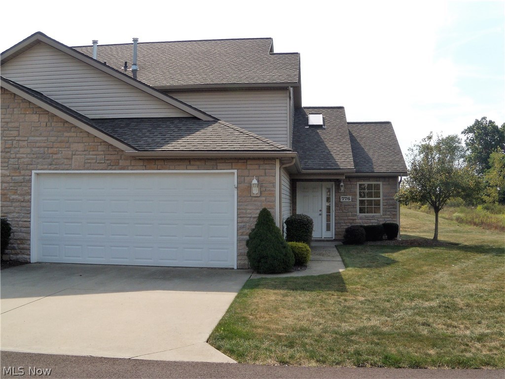 Welcome to 776 Greenhaven Court, a wonderful and spacious 3 bedroom 2 full bathroom condo/townhome in Creekside of Pleasant Lakes. The great room features vaulted ceilings with a skylight and is open to the dining area/eat in kitchen. The large eat in kitchen with a breakfast bar provides plenty of room for entertaining with all appliances included. The first floor bedroom and full bathroom with a walk in shower provide an added convenience. 1st floor laundry/utility room is off of the oversized 2 car attached garage. On the second floor you will find 2 large bedrooms which share a full bathroom. Beautiful Laminate floors in the great room and bedrooms. Large closets throughout provide plenty of storage. The slider off of the dining area steps out to a concrete patio with a private view. The interior has recently been professionally painted and cleaned so all you need to do is move in and make it your own. Schedule a showing today as this one will not last! Convenient to shopping, dini