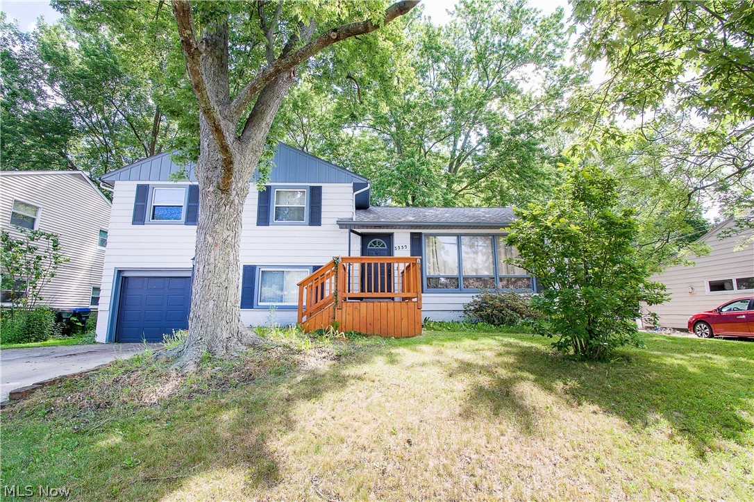 Welcome to 3335 Bailey Rd, Cuyahoga Falls, a split-level-style home. This home features a living room with large windows overlooking the front yard and is open to the dining area. The eat-in kitchen offers a breakfast bar, white cabinets, and a dining area. Upstairs are three bedrooms and a full bathroom. The lower level has a half bath, a family room (with access to the garage), and a laundry room with access to the backyard. The fenced-in backyard offers a cement patio, a fire pit, and two different sheds for extra storage. Some updates include a new roof and shingles (2016), painted the exterior (2019), a new water heater (2018), a front deck (2019), and new subfloors and tiles in the main bathroom (2012). Close to shopping and restaurants. Convenient access to Route 8. Make your appointment for your private showing today.
