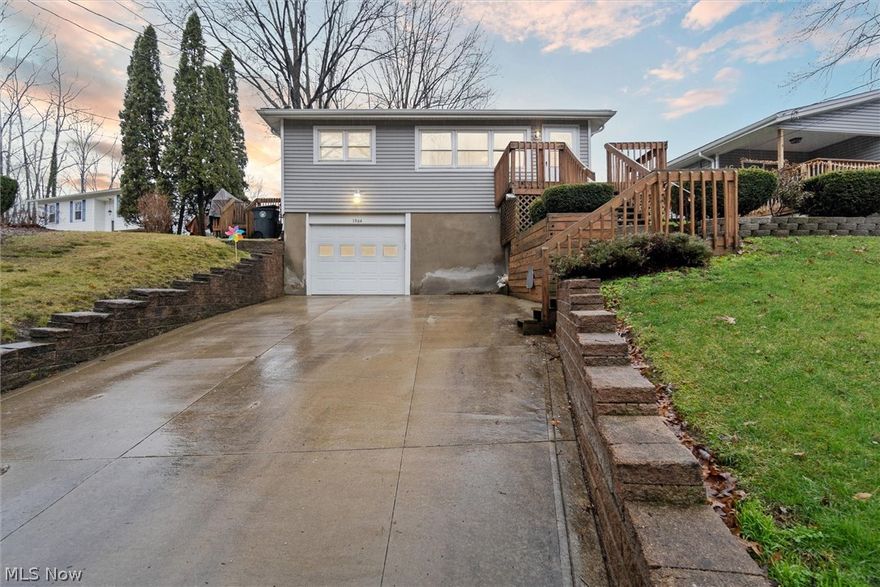 Come take a look at this incredibly well-maintained, raised ranch with a basement that is ready for its new owner! Enter through the garage or take the newer wood staircase to the front door and enjoy all that this cozy home has to offer. The inviting living room flows into the eat-in kitchen with plenty of cabinet and counter space and comes equipped with all appliances--including a side-by-side refrigerator with water and ice dispenser! Down the hall find three nicely-sized bedrooms with hardwood floors. A full bathroom finishes out this functional main floor layout. Downstairs is a partially finished basement with glass block windows, ample storage, a flex room, and laundry set up. Enjoy entertaining outside with the fully fenced-in backyard comprised of two parcels. There's plenty of room for pets and children to roam and mature trees provide shade in the warmer months. This home includes many significant updates, some of which include: HVAC in 2021, new hot water tank in 2019, and