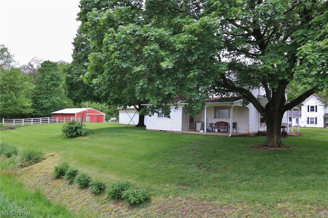 This Dresden area mini-farm features 4 parcels equaling approximately .872 acres with a 3 bedroom, 2 story home, a spacious barn with 9 stalls, a garage with attached carport and a fenced in area around the barn. Home is being sold in "AS IS" condition.