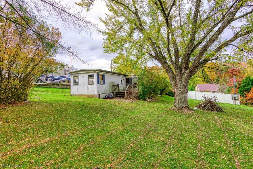 2 bedroom mobile on double sized lot at Atwood Lake. Attached 1 car garage. Large screened in porch. Short walk to lake. Great rehab project. Seller is a licensed Realtor