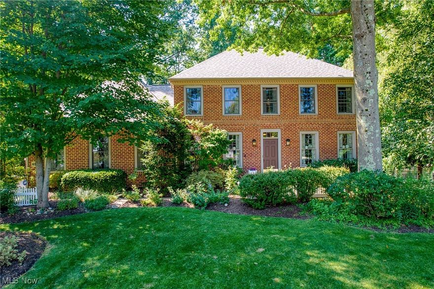 Nestled in the trees of the desirable Cobblestone community, this stunning brick colonial is full of timeless charm and quality craftsmanship. Perfect for the car enthusiast, this home offers an oversized three-car garage with nature stone floors. Inside, you’ll find beautiful wood floors flowing throughout, complemented by neutral paint to match any décor. Plantation shutters adorn every window, adding character and warmth.

The main floor features a private office with glass pocket doors, a formal dining room , and an open-concept kitchen and living room. The kitchen boasts maple cabinetry, granite countertops, stainless steel appliances, and a large island perfect for gatherings. The living room is anchored by a cozy fireplace and a large picture window that fills the space with natural light.

Upstairs, you’ll find four spacious bedrooms and three full baths. The primary suite includes a walk-in closet and a beautifully appointed bath with a walk-in shower. Crown molding accents every room—even the bathrooms.

Outside, enjoy a quaint backyard with a charming garden path and a delightful playhouse equipped with power. This home combines elegance, comfort, and detail in every corner—ready to welcome you home.