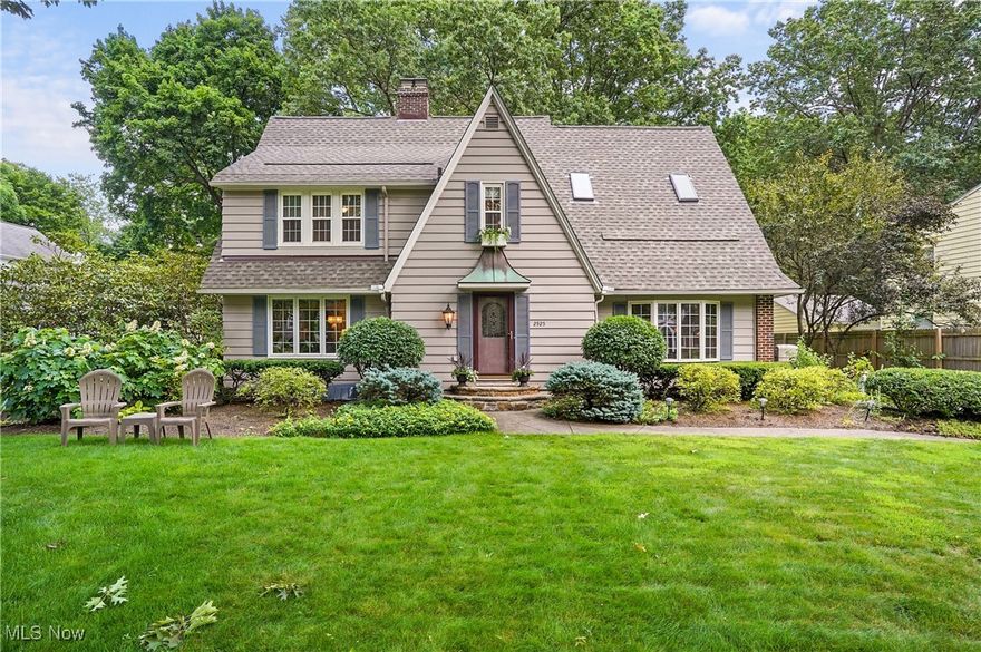 Situated in the heart of Silver Lake Estates and sitting on a 1/2 acre lot is this 4 bedroom 2.5 bath Tudor style Colonial which is filled with charm, elegance and beauty throughout. This home has excellent curb appeal with its stunning architectural features as it stands out in this neighborhood of beautiful homes. From the foyer entry to your left leads into the fireplaced living room and the formal dining room, all with natural wood trim, crown molding and gleaming hardwood floors. Or, to your right step into the warm and cozy library with walls of built in bookshelves and natural light coming through the large bay window. The pristine eat in kitchen has maple cabinets, stainless appliances, granite counters, porcelain tile floors and porcelain backsplash. From the kitchen is the  french door leading to the 18 x 16 rustic outdoor screened porch complete with sink and mini fridge. This home also has a king size family room with wood beamed ceilings, a second fireplace with a gas heater insert and a triple sliding doors that lead to a large patio and parklike backyard. The second floor has 4 spacious bedrooms and two full bathrooms. The master suite is spacious, bright and open. It features a cathedral ceiling,a large palladian window, a built in vanity and a jetted tub. This home has been maintained with excellence. A new roof with 3 new skylights in 2024 is just one of the many recent updates.  The basement is bright and neat and clean with a nature stone floor. This home is located in Silver Lake Estates which  includes lake privileges to enjoy swimming, boating, fishing and lovely picnic areas.