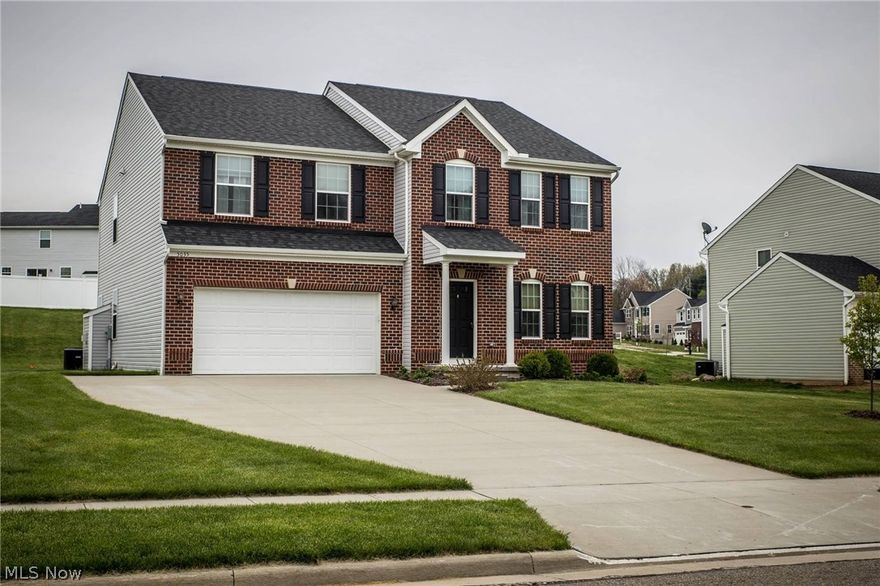 Welcome to 5035 Stoney Creek Lane in North Canton in Green Schools.  "You could build for less but not with the upgrades that come with this house."-  There are hardwood floors throughout, gas fireplace, island in the kitchen, stainless steel appliances, ceiling fans, surround sound in family room, wiring for internet, ethernet jacks everywhere, extended cabinets, loft area, dual control for air, security system, dual vanities and white trim throughout.  There is a 2nd laundry.  Master suite with his and her sinks, soaker tub + shower and his & her closet space.  Interior has been freshly painted. Newer window coverings and the basement is plumbed for a full bath. Tons of natural lighting throughout + quality. Owners comments on neighborhood: very organized and kid friendly. They hold Halloween trick-or-treating & Easter egg hunts! Great location- close to high way access and amenities. Call/text today to schedule a showing.