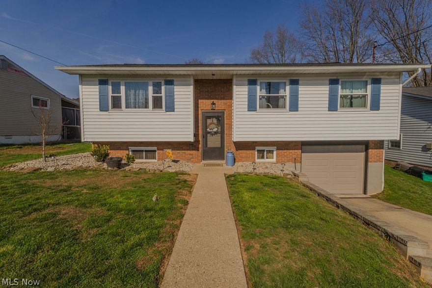 A layout that flows, a location that works, and a home that fits real life from day one. Tucked into a lesser known pocket of North Parkersburg, just minutes from Core Road and everyday conveniences, this split foyer offers that balance of easy access and a setting that feels just a bit removed.

Step into the foyer and head up to the main living space where natural light pours through the windows, brightening an open living, dining, and kitchen layout designed for connection. The kitchen stands out with white cabinetry, gray countertops, stainless steel appliances, and a gas range with a center burner. A long bar anchors the space, comfortably seating three to four, perfect for casual meals or gathering with friends.

Down the hallway, you will find three bedrooms and a full bath, with hardwood flooring carrying through most of the main level for a clean, cohesive feel.

Back through the kitchen, step onto the covered porch that transitions into a screened in area with brick detail, creating a comfortable spot to unwind. Just beyond, a mostly level backyard offers space to spread out, grill, or enjoy the outdoors, complete with a storage building for added convenience.

Back inside, the lower level expands your living options. A spacious family room sits to the left, while the laundry room is positioned near the stairs for everyday ease. To the right, a fourth bedroom and a nearby half bath provide flexibility for guests, hobbies, or work from home needs. Continue through to access the one car garage.

With its thoughtful layout, inviting spaces, and location that keeps you close to everything while feeling just a bit removed, this home delivers the kind of everyday comfort that is hard to find.