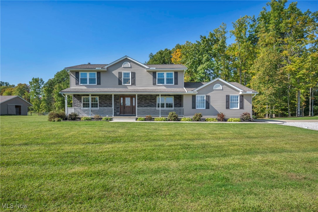 Discover the perfect blend of comfort and countryside living with this beautifully updated and meticulously maintained 3 bedroom, 2.5 bath home on over 7 acres, w/ a 4-stall horse barn, pole barn, pastures & much more. This move-in ready Colonial offers over 2,600 sq ft of living space including a finished lower level and so many thoughtful finishes throughout. An updated eat-in kitchen showcases rich cherry wood cabinetry, quartz countertops, stainless steel appliances & porcelain tile flooring. Brazilian teak hardwood flows throughout the main floor, including an inviting family room w/ a floor-to-ceiling stone wood-burning fireplace. A formal dining room is enhanced by custom cherry wood pantry cabinets. Convenient 1st-floor laundry room & attached 2-car garage. The primary suite has an updated en-suite bath w/ double vanity, heated floors, and a walk-in closet. The lower level adds versatility with a spacious recreation room, workshop area, and abundant storage. Outside is an equestrian’s dream. The horse barn includes 4 matted stalls with heated automatic waterers, a tack room, feed room, and wash stall. Four connected pastures with low-voltage electric fencing provide ample safe roaming space. The 30'x64' pole barn with a 14-foot overhang easily accommodates a 30-ft horse trailer attached to a truck. For canine companions, a covered dog kennel w/ cement pad, roof & electricity offers comfort & convenience. This property combines thoughtful interior updates with outstanding equestrian facilities, perfect for those seeking both a warm home and space to live their passion. Recent updates include: Replaced roof & HVAC (2017), multiple windows (2023/2022/2012), vinyl siding (2015), finished the basement (2017), updated kitchen (2013), master bath (2015), guest & 1/2 bath (2021), replaced flooring thru most of house w/ Brazilian teak hardwood & porcelain tile, built pole barn (2014) & so much more! A detailed list of all updates is available upon request.