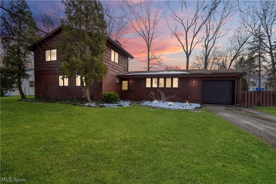 Welcome home to this awesome ranch with a second floor addition!  Four bedrooms (two on the main floor).  Large "L" shaped living room/dining room with engineered wood floors as well as a cozy family room with a wood burning fireplace and newer carpet.  Kitchen with lots of cabinet storage and stainless steel appliances.  Attached garage with entry into kitchen.  Large laundry room with lots of storage.  Bonus, private living suite upstairs includes living area and two bedrooms all with new carpet installed in 2022 and a full bathroom. There is also a deck off of this living area with stairs going down to the backyard.  Decking and handrails were also done in 2022.  Enjoy your large fenced in backyard with daffodils, hydrangeas, roses and concord grapes  Nice shed stays also.  The electrical was completely updated in 2022.  Both furnaces were installed in 2010.  The main furnace is 95% efficient.  The family room fireplace is a Preway that draws in air from the outside and feeds heat o