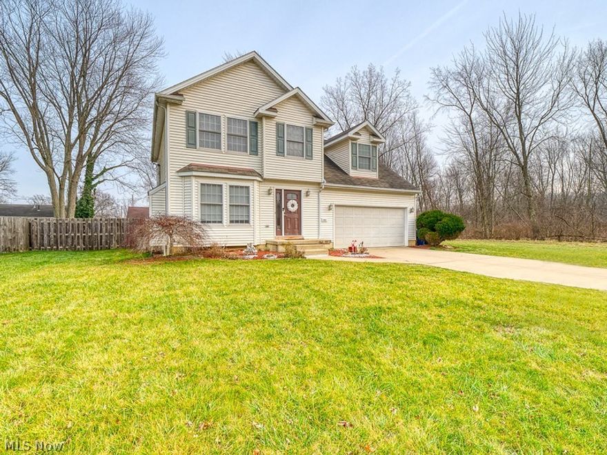 This beautiful colonial sits just seconds from the Lake! As soon as you walk in this move-in ready home, you will love the cozy living space that features a gas fireplace and tons of natural light. Boasting newer vinyl flooring throughout the main level. A large eat in kitchen is perfect for entertaining and walks out onto the private patio! The gorgeous kitchen features stainless appliances, newer cabinets and great counter space! A large half bath completes the main level. The second level features a LARGE bonus room that could be used as a 4th bedroom / play area and has so much potential. An updated hall bath, 3 great sized rooms, including a master with high ceilings and a full master bath on suite! With a clean basement with so much storage, a fully fenced in backyard, and large vacant land next door, there is so much room to entertain!