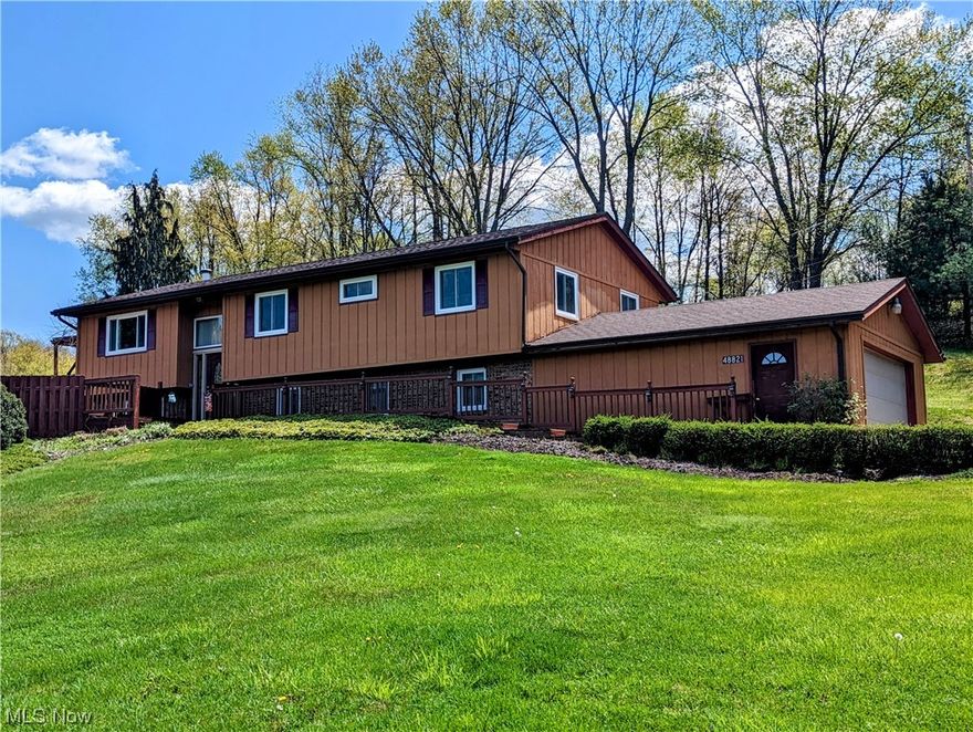 Beautiful sprawling home on 5 acres in Beaver Local School District.  Enjoy the views from the multiple decks, in ground pool and large hot tub.  All of the expensive upgrades have been done.  The windows and fence in the last 2 years, roof, carpet, and doors are less than 3 years old.  The ac/heat split unit is 1 year old.  The washer and dryer are less than 5 years.  There is a working wood burning stove downstairs.  The downstairs is finished, with family room, pool room, weight room and full bathroom.  It could easily be partitioned to add more bedrooms.  The pool liner and filter have been updated.  The decks are all to be repainted by seller.  Come see this gorgeous property before it slips away.