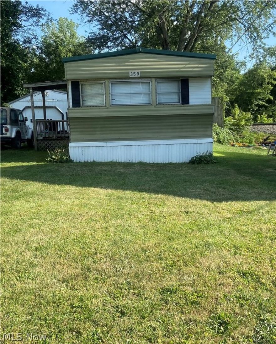 Nice trailer with 2 bedroom 1 bath. One car garage.  New metal roof on the house in 2021 and on the garage in 2024. Private fenced in back yard with a shed.