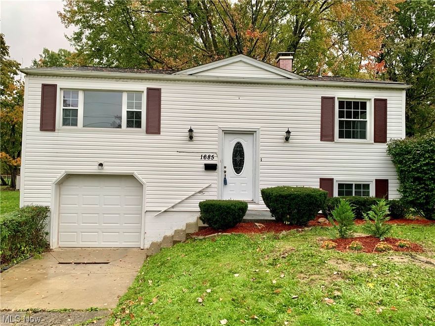 Come check out this move-in ready 3 bed/1.5 bath bi-level home in Austintown! It boasts a total of 1,872 sq ft with 900 ft on the main floor and 972 ft on the lower level. When entering through the front door, one can either venture upstairs into the well-lit living room, the kitchen, the full bathroom or wander into the 3 bedrooms. Going down to the lower level you will pass the utility room which houses the 1/2 bath, the HVAC & laundry area. There's also ample storage under the steps for your holiday totes. Beyond the storage area you'll find a huge family room which leads to the attached 1+ car garage separated by a steel door (the garage is 17' x 12'). There is a walk-out area from the back of the garage which leads to a fire pit area and just beyond to the left of the backyard is Wedgewood Park! What an ideal location! Updates include: Some painting throughout interior of the home within the past year; tree removal '23 (front yard); new plumbing in front yard; new toilet in lower level; new dryer '23; hot water tank '21; new C/A '23; new stainless steel dishwasher and microwave in '23; new luxury vinyl plank flooring in kitchen; new carpeting in livingroom & foyers '23 (the other carpeting was not replaced since it was < 1.5 years old but it was steam cleaned just prior to listing it). Replacement windows <15 years old; furnace is a TRANE but age is unknown. Come see it today and get into your new home before the Holidays!!