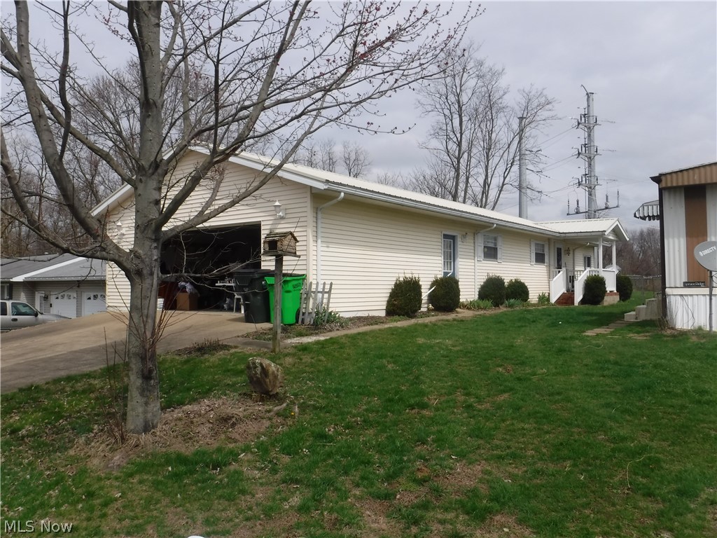 This income producing property is conveniently located in the heart of Dresden on a dead end street. The cozy, custom built 1997 ranch style home features 2 bed. one bath, laundry room, eat-in kitchen, living room and an inviting sunroom along with an attached two car garage. An updated metal roof was installed 5 yrs. ago. The property also features 2 mobile home lots that have two long term rentals on them that produce $400 per month income. Mobile homes are not included. Buy this property and let the rental fee help pay your mortgage.