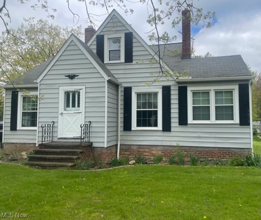 Charming 3-4 bedroom cape in Independence! Lovingly maintained.  From the moment you enter this home, you will see the hardwood floors. The living room boasts a woodburning fireplace and a large picture window. On the other side of the living room you will find a sun room which is great for enjoying crafts, or use as an office or fill with plants! The dining room has a built in china cabinet and is easily accessible to the bright and cheery kitchen. You will find 2 bedrooms, including the master bedroom and an additional one on the main floor. The full bath has a tub/shower, vanity, commode and linen closet.  Upstairs you will find another bedroom with a tandem bedroom that can be used as an exercise room or sitting room, as well as plenty of closet space & a half bath  The full basement has a large area for a future recreation room with a decorative fireplace and awaits your finishing touches.  In addition, there is a large laundry room, with a shower stall and a workshop. Furnace and