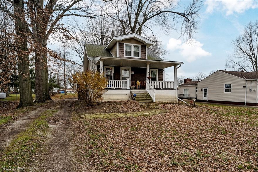Welcome home to this charming cape cod on a half acre lot in Eastlake! This delightful home has 4 bedrooms, 1.5 bathrooms and valuable updates throughout, including a new roof, siding, HVAC, windows and doors within the last 5 years! The covered front porch opens to the living room, where you will find newer wood-look floors. The living room is open to the kitchen, which includes a newer dishwasher and range, plus plenty of cabinet space and a sunny eat-in area. A back door opens out to the back deck, perfect for summer cookouts! There are two bedrooms and an updated full bathroom on the first floor. Upstairs, you will find two additional bedrooms and a half bathroom with a bonus area where you could easily install a shower or tub to make a second full bathroom. The full lower level includes a laundry area and plenty of storage space, plus there is egress to the backyard. Outside, there is a front porch, a back patio, and a large 3-car garage. Located just off of Vine Street, this home