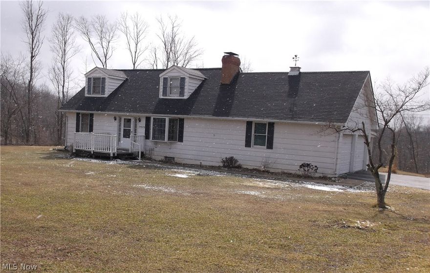 REDUCED!  Relax and enjoy the quiet country setting from the back porch on this ready to move into 4 bedroom, 1 1/2 bath home on 3.81 acres.  Eat in kitchen with appliances, formal living room, hardwood floors and oak trim throughout.  Fireplace with insert in family room in basement with outside entrance.  Mud room and 2 car attached garage.  200 amp electric service.