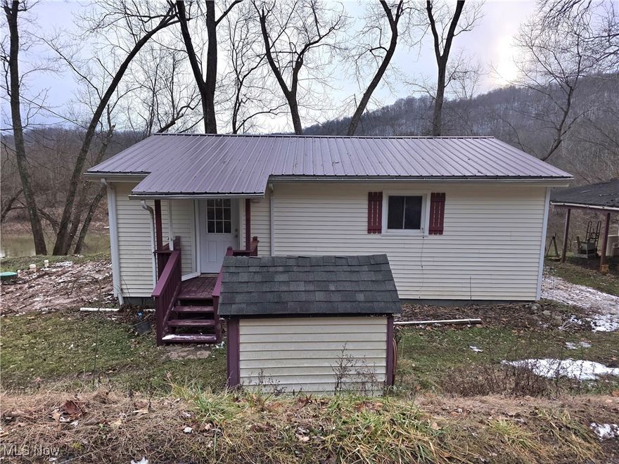 Charming Renovated Cabin in Creston, WV.  Welcome to 12286 Little Kanawha Parkway, a delightful retreat just 13 miles from Elizabeth, WV. This beautifully renovated home is move-in ready, boasting a new metal roof and a brand new aeration septic system for peace of mind.  Step inside to discover updated flooring and a cozy ambiance, perfect for modern living. The property includes convenient off-street parking and a scenic covered and screened back porch where you can relax and take in stunning views of the Little Kanawha River well known for it's great fishing opportunities.  Additionally, a small private room equipped with its own heating and air conditioning provides a unique versatile space for an office, reading room, studio or a private retreat. If space is an issue, beside the home is a storage building/workshop with electricity.  Don't miss this opportunity to own a charming home in rural West Virginia, combining comfort with nature's serenity where you can vacation or live year round. Schedule your showing today!