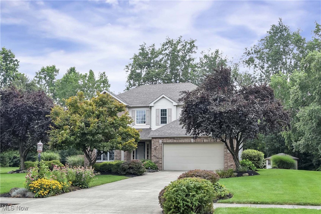 Prepare to be moved! Located at 4712 Belmont Dr., Avon, OH 44011, this gorgeous custom built two-story colonial offers striking curb appeal with a brick façade and a lush front yard professionally landscaped and is easily maintained with the sprinkler system. Inside, the inviting layout begins with maple hardwood flooring that flows seamlessly from the foyer through the hallway, kitchen, and dining areas, and custom high-end Pella windows with window treatments that are featured throughout the home. The spacious kitchen features abundant cabinetry and counter space, and included appliances, making it a welcoming space. Adjacent to the kitchen, the 3-season sunroom provides an excellent setting to enjoy outdoor views and some morning coffee. The family room is centered around a gas fireplace, creating a warm and inviting atmosphere. A dedicated laundry room and convenient half bath, complete the main floor. Upstairs are four generously sized bedrooms. The primary suite features a walk-in closet and a private en suite bathroom with a dual sink vanity, walk-in shower, and separate soaking tub. The remaining bedrooms share a second full bathroom. The finished basement is perfect for entertainment, hobbies, or a home office, and includes an additional half bath. Plus there is a over 400 square feet of unfinished space with added outlets and overhead lighting. A radon mitigation system and subpanel electric breaker box were added in 2016. Out back, enjoy a large Trex deck overlooking an impressive yard, with a custom-built shed. The two-car garage is outfitted with a durable polyurea-polyaspartic coating (2022), folding bicycle racks (2022), and Gladiator wall storage shelving (2022). Mechanical improvements include HVAC (2016), Roof (2016), HWT (2019) and humidifier (2020). Ideally located close to the community pool, within walking distance to Eagle Point and Veteran’s Park, and just a short drive to Avon Commons and I-90. Schedule your tour today!
