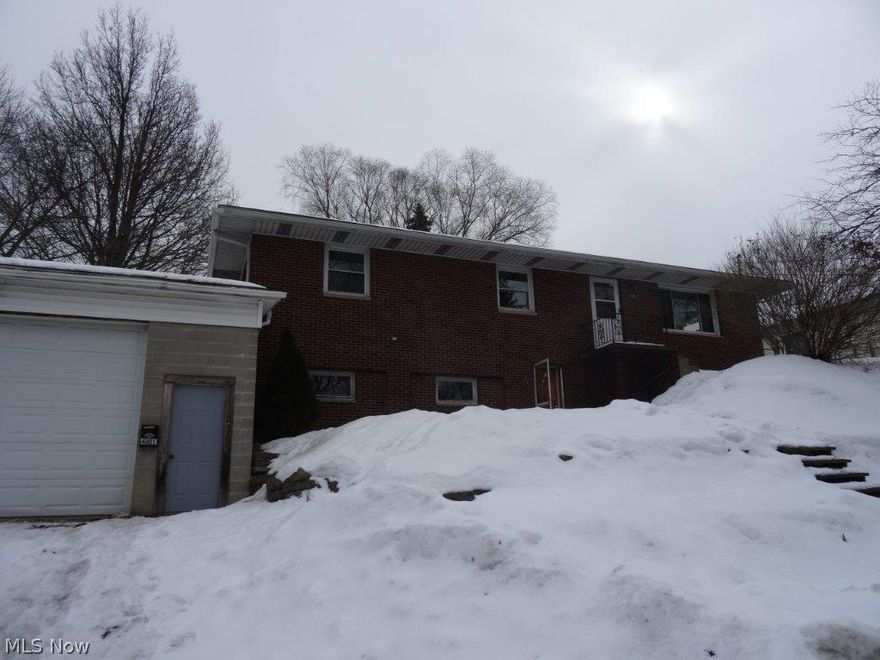 Investor special!  All brick raised ranch, huge 2 car attached garage, some newer windows, needs some TLC.