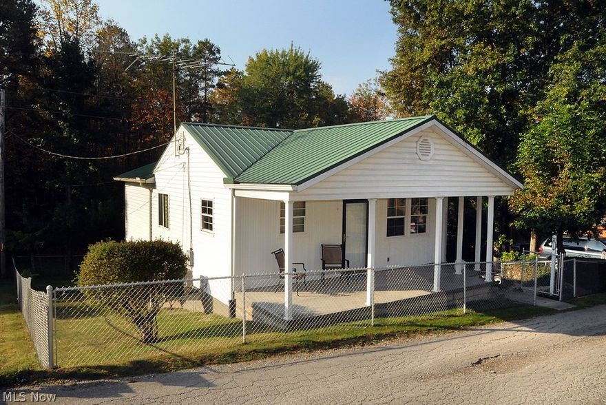 This home has been lovingly renovated.  Large sunroom with wood floors, master bedroom with private bath, open kitchen and dining area with tile flooring and oak cabinets.  Walkout to covered patio, completely fenced yard with off-street parking.  Home could have 3rd bedroom.  Storage above the covered porch, and storage shed