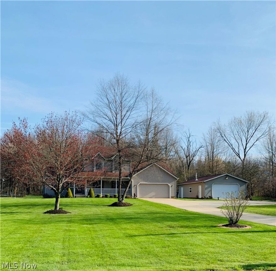 Welcome home to 3115 Old Forge Road in Rootstown Twp. Check out this 2-story colonial on 2.75
manicured acres with 24x40 pole building with wood burning stove, 12x16 shed, 6x8 garden shed,
fenced in raised vegetable garden with open green space & back treed lot. Enter first level from the
covered front porch to the 12x23 living room with brick face gas fireplace, cathedral ceiling and beautiful
oak hardwood flooring. The 10x12 dining room has oak hardwood flooring with patio doors leading to
exterior covered porch. Exquisite 12x12 kitchen boasts Kraftmaid cherry cabinetry, stainless steel
appliances and large pantry. The 11x17 first floor master bedroom with walk-in closet and full master
bath includes double sinks, jetted tub & walk in shower. Rounding off this level is a half bath, 7x7
laundry room including washer & dryer. The second floor has 3 nice sized bedrooms with new neutral
carpeting & full bath. The 604 sq ft L-shaped recreation room in the lower level has so much