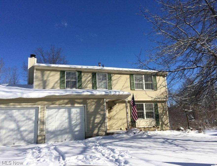 Wonderful family friendly neighborhood.  Home is located on a park like cul-de-sac and backs up to Silver Springs Park.  This lovely 4 bedroom 2 1/2 bath colonial is freshly painted throughout.  There are hardwood floors in the living room, dining room, and family room.  The foyer and kitchen have a slate floor. Going up the stairs to the bedrooms there are beautiful hardwood steps and the upstairs has brand new carpeting.  There are many updates including a solid surface counter in kitchen and all the appliances are stainless steel and remain with the home. Bathrooms have also been updated.
The family room boasts a wood burning fireplace and leads out to a very large deck and private back yard.  
 Lovely home in a great area of Stow.  Don't miss seeing it.