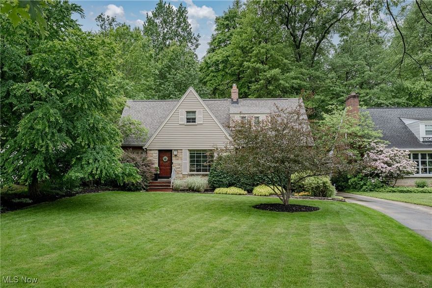 Welcome to 1528 S Belvoir Blvd – a charming, well-maintained 3-bedroom, 1.5-bath Cape Cod in the heart of South Euclid! This home is full of character with beautiful wood floors, a spacious living room featuring a picture window and a sandstone fireplace flanked by built-ins, and a large formal dining room filled with natural light. The updated kitchen offers granite countertops, a tile backsplash, included appliances, and a bright eat-in area with skylight. Just off the kitchen, enjoy the sun-drenched sunroom with wood flooring, a full wall of windows, and walkout access to the backyard. A convenient half bath is located on the main level. Upstairs, you'll find three generously sized bedrooms and a full bath. The lower level is mostly finished, offering bonus living space and direct stair access to the attached 2-car garage. Outside, step onto the patio surrounded by well-kept garden beds and mature landscaping—a peaceful backyard oasis, perfectly tucked away on a beautiful lot. Additional features include newer windows and a sump pump. This move-in-ready gem blends comfort, charm, and convenience—don’t miss it!