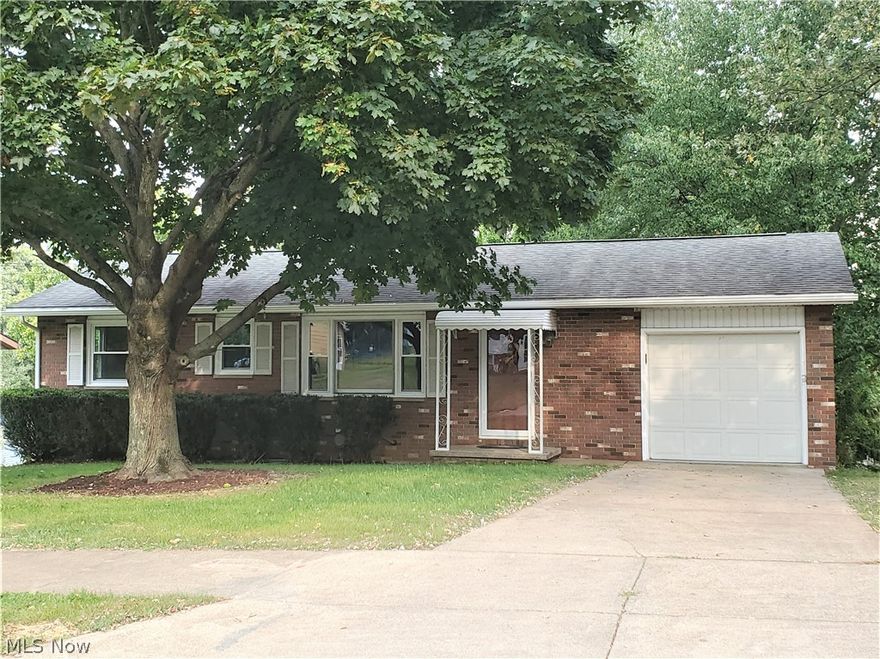 Lovely renovated home with replacement windows, bath remodel, interior paint, carpeting & vinyl all in August, 2021. Walkout basement has some paneling and cabinetry for a rec room area with sliding door to a nice covered patio (20x9), great for picnics and relaxing with privacy hedge row across the rear yard. Just a few blocks from shopping, banks and restaurants, this one won't last.