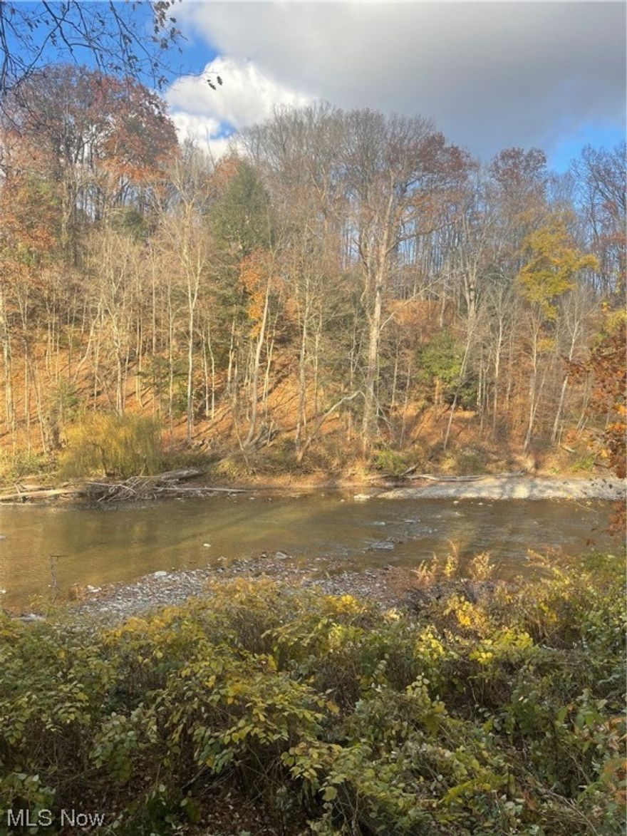 Gorgeous, one of a kind RIVERFRONT property in private community on Eagle Nest Lane in Willoughby Hills. Enjoy Breathtaking views from every window in the home!  Cape cod style charming home with 3 bedrooms, 2 full baths up and 1 half bath on main level. Living room has adorable beamed ceilings, gas fireplaces, finished basement for home office or entertaining, bright and beautiful den attached to 2 car garage.  Kitchen has newer appliances, corian counters, maple cabinets, and breakfast nook for enjoying riverfront views with your morning coffee. Genrac adapter installed with switches to electrical box, buyer would need to purchase and install an exterior unit to complete the system. Boiler about 12 yrs old, roof 2 yrs old, fully insulated last year, fully waterproofed basement. Don't miss your chance to own this secluded, once in a lifetime waterfront property! Near shopping, highway access, Dtw!