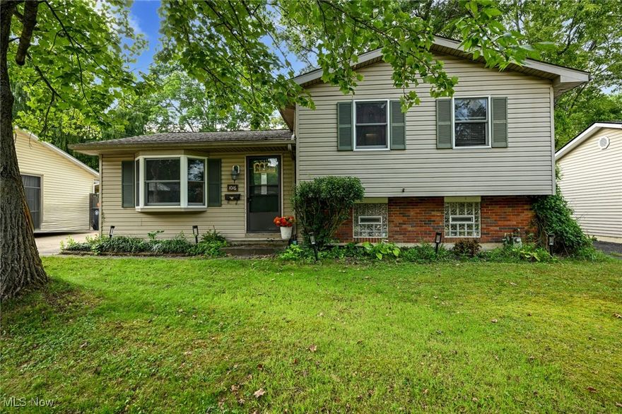 A Merriman Valley gem!  This contemporary home on Ellsworth Drive features a spacious living/dining area with hardwood flooring and luxury vinyl tile that opens to the covered patio. Your fenced backyard extends the space for outdoor entertaining.  Upstairs, all three bedrooms have hardwood flooring and your bathroom has a new spa-like tub/shower surround and vinyl flooring. The lower level family room is a great space - perfect for a bar, movie room or play room.  There is a laundry room, storage area and walk-out to the backyard too!  Convenient to Weathervane Playhouse and all the great restaurants and services of "the Valley" you will also be centrally located between Cuyahoga Falls, Fairlawn, West Akron and Peninsula. Sand Run Park is accessible at the end of the street.  New hot water tank (June 2024), kitchen appliances (2023), new ceiling fans, too.  A Guard Home Warranty is offered for your peace of mind.