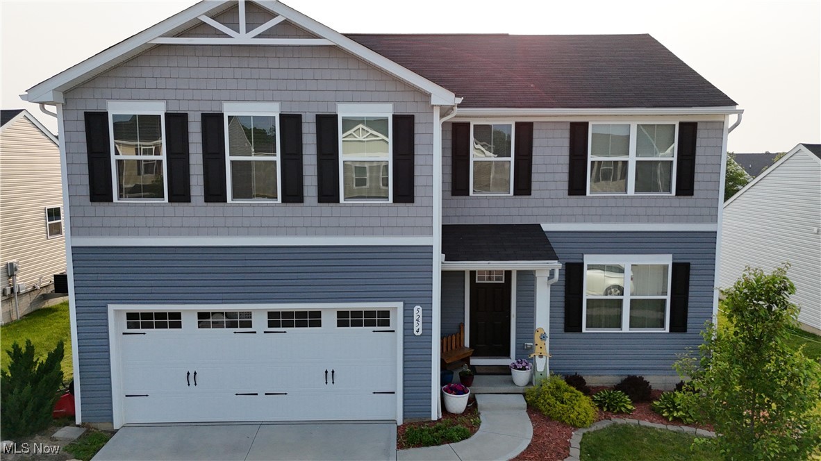 Welcome to 5254 Decker St, a stunning 5-bedroom, 2.5-bath home located in the highly sought-after New Haven neighborhood of Barberton! Close access to I-76 makes commuting a breeze. This modern and newly built home offers well over 2,000 sqft of beautifully designed living space. Step inside to find a bright, open and inviting floor plan featuring a spacious entryway that flows seamlessly into the family room area w/ a half bath. The gorgeous eat-in kitchen boasts ample cabinet space, a large center island, and modern finishes—ideal for everyday living and entertaining. Upstairs, the expansive master suite is complete with his and hers walk-in closets and an en-suite bathroom w/ dimming lights, a double vanity, and standing shower. Four additional bedrooms provide plenty of space for family, guests, or a home office. Finishing the second floor is a convenient laundry room and full bathroom w/ double sinks. Walk out the sliding glass doors to find your private backyard with a lovely patio and pergola—perfect for relaxing or hosting summer gatherings. With no rear neighbors, you’ll enjoy added privacy, and you’re located conveniently close to the community park. The attached 2-car garage and full basement adds plenty of additional space to utilize. Don’t miss your chance to own this move-in-ready home in one of Barberton’s most desirable neighborhoods. Close to shopping, restaurants, parks, and more! Schedule your private tour TODAY!