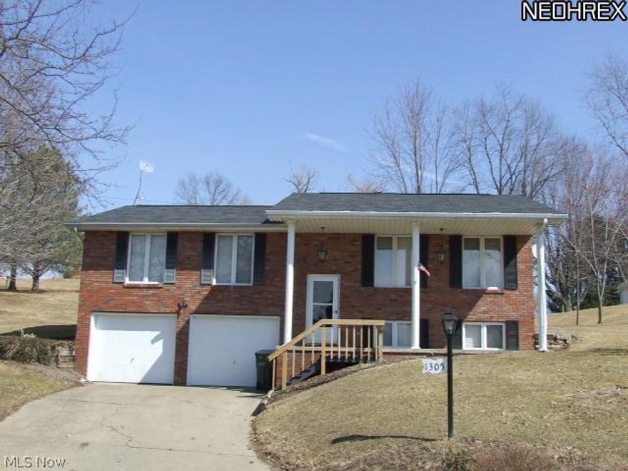 Nice brick split level on huge double lot. 2 story pillared front porch, new carpet, paint & some flooring. Dining room features sliding doors to patio & spacious back yard. Lower level has a full bath & family room. Plenty of storage, close to I-77.
