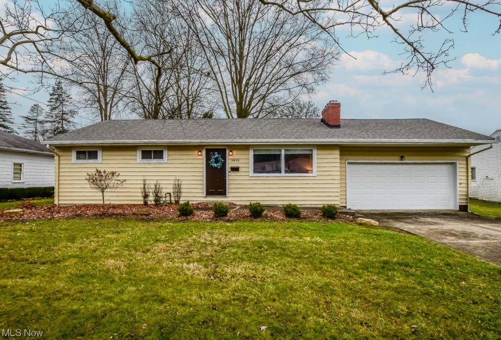 Step into this fully remodeled ranch, updated in 2021 for comfortable modern living! As you enter the living room, discover refinished hardwood floors, recessed lighting, a picture window, and a charming faux fireplace with a stone surround. The stunning eat-in kitchen boasts granite counters, soft-close cabinetry, stainless steel appliances, a tile backsplash and dining space with scenic backyard views. All three bedrooms feature hardwood floors, double closets, and ceiling fans, sharing an updated full bath with a tub and shower. The full unfinished basement offers a laundry area and room for expansion, including another potential bathroom and storage space. Additional amenities include a two-car garage and a parklike backyard with mature trees shading the patio. Newer windows and roof add even more value to this move-in ready home, perfect for first-time buyers and growing families. Call to schedule your showing before it's gone!