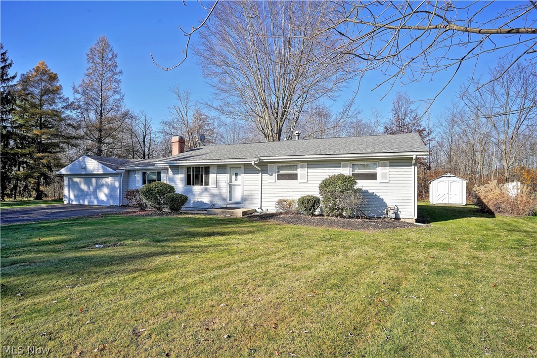 WELCOME HOME to this stunning three bedroom, one and a half bath Ranch Home on a huge half acre lot; it's the biggest lot in the neighborhood, nice and private! In 2006 the kitchen was remodeled with corian counters, and lovely kraft made cabinets with plenty of storage, as well as the half bath, laundry room, new fixtures and new tile floors. Nice open dining room located off the kitchen and living room area, with sliding glass doors to let the natural light to shine through and lead you out onto the large deck. Step down into the family room with gleaming hardwood floors, recessed lighting and a cozy corner gas fireplace. As you proceed down the hall there is a nice size linen closet along with the bathrooms and the three bedrooms. A 266 square foot addition completed in 2008 with maple hardwood flooring, is very well insulated. The furnace/hot water and A/C were replaced in 2006. There is electric and gas and hookups for both in the home. A new roof was installed in 2011, as well as