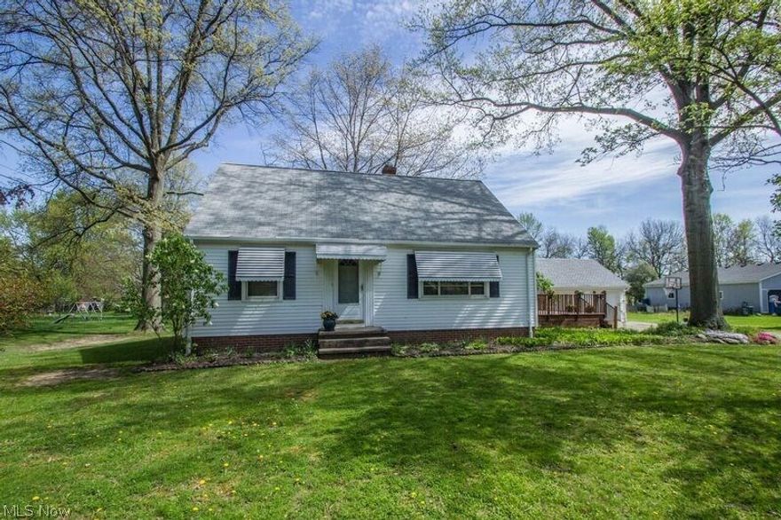 Feels like home tucked away in a quaint section of Olmsted Township on a private wooded, very deep generous lot. Hardwood floors welcome you as you enter and views of the back yard are showcased throughout. Cozy living/dining room hosts family gatherings. Two bedrooms and a first floor bathroom by a generous eat-in kitchen space! Finished upstairs bonus room. Lower level offers entertaining and play space for friends and family. Large utility area includes a full bathroom. Extended off kitchen entrance is a beautiful 340 sq. ft. raised wood deck! Sought after neighborhood with golf directly across the street.  Come see for yourself won't last long.  Furnace and AC 2012, HWT new,  Ohio State Waterproofing did basement w/transferable warranty.  Garage roof 2016!