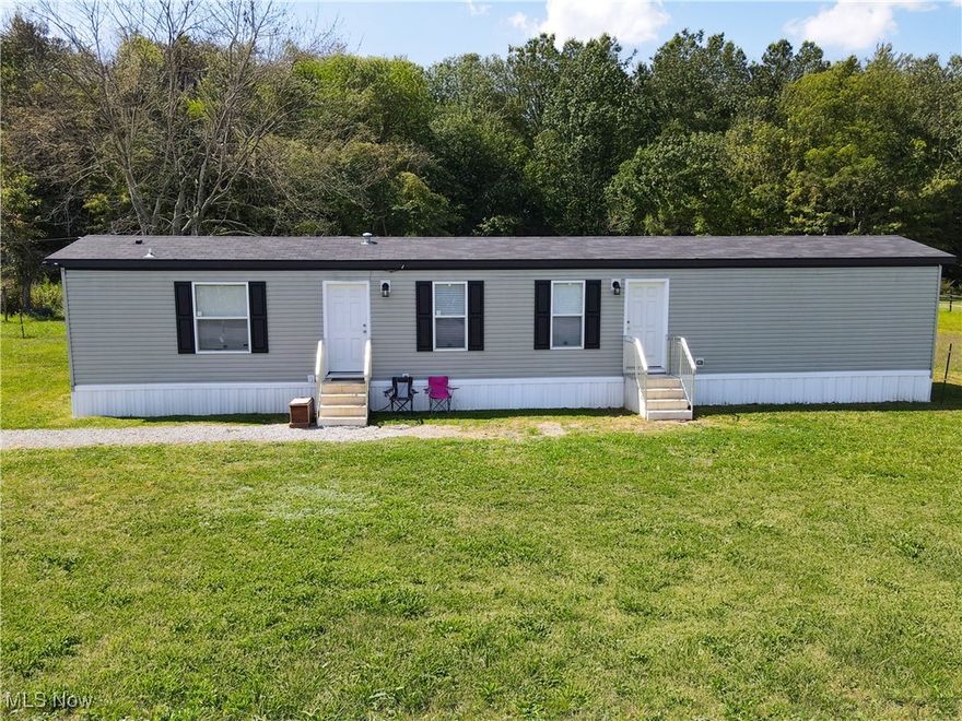 Endless Possibilities on 8.9 Acres!  This 3-bedroom, 2-bath mobile home sits on a beautiful 8.9-acre property that offers both comfort and opportunity. A fenced area once used for horses is ready to be brought back to life, while the shed and outbuilding provide great space for storage, hobbies, or projects. The back of the property is filled with large trees, perfect for privacy or exploring, while the front acreage is cleared and ready for gardening, recreation, or even future building.  Whether you're dreaming of a small homestead, a place for animals, or simply a peaceful country setting with room to grow, this property is ready for you to bring your vision to life. Don't wait, opportunities like this don't last long!!