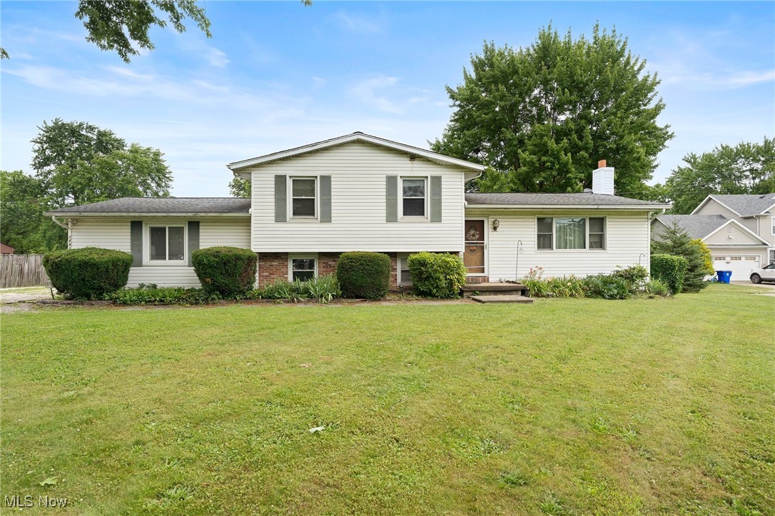 Welcome to 1781 Old Forge Rd – a beautifully maintained split-level home offering comfort, versatility, and space to grow. Step into a bright and airy living room filled with natural light, flowing seamlessly into the dining area with direct access to the backyard deck—perfect for hosting guests or enjoying a quiet evening outdoors. The kitchen features rich hardwood cabinetry, matching wood flooring, and a cozy eat-in nook ideal for everyday meals. The upper level offers three spacious bedrooms and a full bathroom, providing comfort and privacy for all. On the lower level, you'll find a generous family room, an additional bedroom, and a full bathroom with a double vanity—ideal for guests, in-laws, or a private retreat. A standout feature of this home is the bonus level, which includes a fantastic billiard room and a fully enclosed sunroom/bonus room that connects to the garage—perfect for year-round entertaining, a home gym, office, or flexible living space. The unfinished basement offers laundry and excellent potential for additional living area, storage, or custom finishes. Outside, enjoy a large backyard with plenty of room to play, garden, or gather, plus a convenient storage shed. This home blends classic charm with modern functionality on a beautiful lot—don’t miss your chance to make it yours!