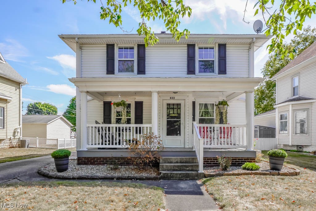 If you’re looking for a home brimming with character and updated for today’s living, this century colonial is sure to impress! A wide front porch with low maintenance vinyl railing sets the tone, perfect for enjoying morning coffee or relaxing on summer evenings. Step inside to a living room centered around a cozy fireplace with original woodwork that continues into the dining room, where hardwood floors make the space warm and welcoming. The kitchen blends vintage charm with modern convenience, featuring stainless steel appliances, classic cabinetry, and room for casual meals. Just off the kitchen, the mudroom with original built ins keeps everything organized and leads right out to the backyard.
Upstairs, a built in linen cabinet in the hall is a nod to the home’s history as you head toward three bedrooms with hardwood floors and beautiful wood trim. The full bath offers wainscot paneling, a pedestal sink, and a tub with shower combination. A bright bonus sunroom is the perfect spot for reading, play, or creative projects. The basement provides extra storage, laundry space, and another convenient shower.
Outside, the fully fenced backyard feels private and peaceful with a covered stamped concrete patio, ideal for gatherings or quiet evenings. A detached garage and off street driveway parking complete the picture. All of this is tucked into a small town neighborhood with tree lined sidewalks, close to schools and parks, making it a wonderful place to call home. Don't miss out, call to schedule your showing today!