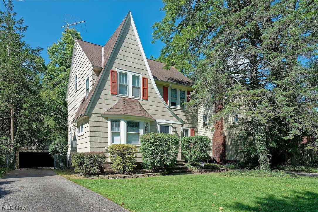 STOP! This Cleveland Hts home is a MUST see!! Well maintained original hardwood flooring throughout, this home has 3 bedrooms, as well as a large finished third floor that is great flex space; perfect for use as a 4th bedroom, home office, study, craft space whatever you need! Updated Kitchen and appliances, light fixtures, and so much more. Kitchen offers coffee bar and storage bench, formal dining space has original built ins, adding tons of character! All appliances including washer and dryer will stay. Full bathroom upstairs has been updated. Have your morning coffee or tea in the 3 season room on the second floor and enjoy the shaded privacy of your own backyard. Boiler is NEW (2023), the kitchen updates included electrical with updated 100 amp service, gas lines were also updated in this home, gutter guards added for ease of maintenance as well as heating coils on the roof. Basement offers a workbench space, laundry room, canning storage room, and more flex space for stora