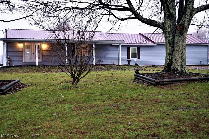 Extreme home make over! Beautiful and "like new" ranch home on 7.0 acres. Move right in to this 3 bedroom 2 bath completely renovated ranch. Features complete in 2018 start with metal roof, vinyl siding, windows, drainage, electrical, hickory kitchen with granite, fabulous master suite with master bath and walk in closet. 24x24 detached garage. Don't miss out! More updates too numerous to mention. Call today.