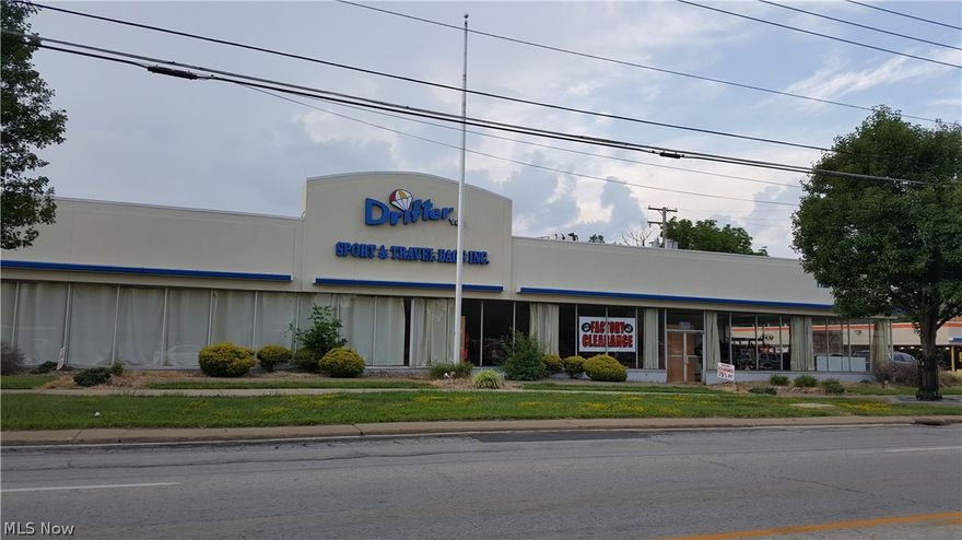 Over 30,000 square feet, was a car dealership, recently manufacturing. Large showroom, many offices, large warehouse area. Second floor offices.  
The address is 2 parcels.  Parcel No. 473-21-007 and 473-21-034
The total measurements are 191.16 x 515.67 x 180 x 299.81 x 292.19 
The Seller will also do a lot split to the parcel north of 007