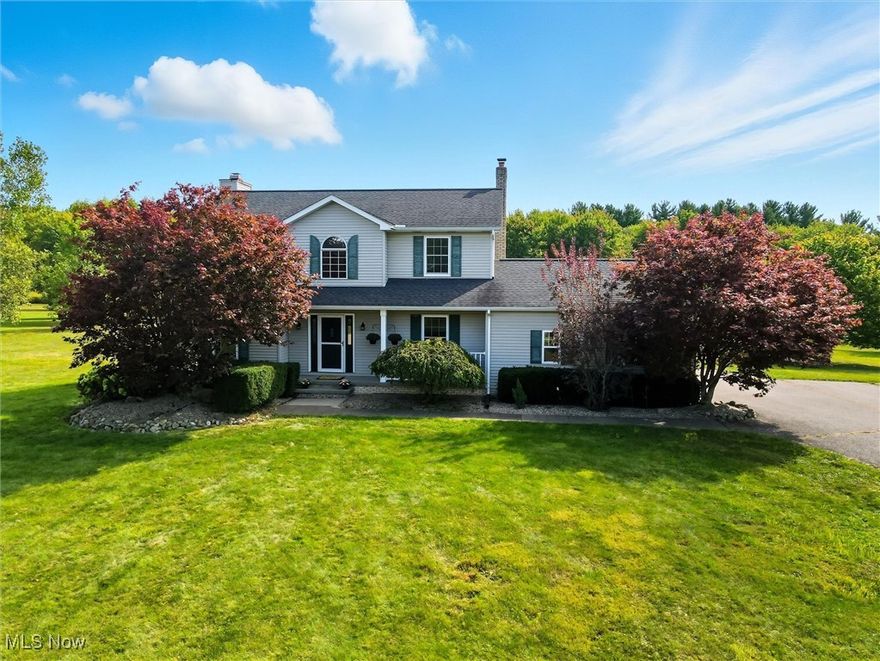 Beautifully Updated Colonial nestled on 3 Acres in the Berkshire School District.  This charming 4-bedroom, 2.5-bath colonial offers the perfect blend of modern updates and country tranquility. This home features wood flooring, ceramic tile, newer carpet, and a newly added laundry/mudroom for everyday convenience. The open-concept kitchen flows into the dinette area and overlooks the cozy living room with its classic brick fireplace—ideal for gatherings. A formal dining room provides space for special occasions, while the main-level bedroom offers flexibility as a guest room, office, or playroom. Upstairs, the spacious primary suite includes an en-suite bath and walk-in closet, along with two additional bedrooms and a full bath. The partially finished basement creates the perfect space for a recreation room, family lounge, or home gym, while the unfinished side offers generous storage. Step outside to enjoy the oversized deck with peaceful views of the picturesque backyard, where nature abounds. A large barn/outbuilding with a loft and pens adds even more versatility for hobbies, storage, or small livestock. Located in Claridon Township this wonderful home also includes a 1-year America’s Preferred Home Warranty.