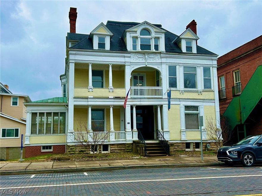 Located on a corner location of Putnam and 4th with a signaled intersection. Property has built in shelving throughout, multiple decorative/closed fireplaces, and one gas log fireplace.  First floor has a vestibule entry, foyer, conference room, four offices, a storage room and a small kitchenette/beverage counter in the hall. We still have the original wide wood trim and carved banister, transom windows, etc., simply beautiful.  The second floor has four offices, a shared hall seating area, one half bath and an additional half bath that is private to one of the offices. This second floor was updated in 2017 with new paint/decor, carpet floor coverings, etc. We have 1380+/- square feet unfinished in the walk-up attic; so much potential in this space. Ingress/egress to rear parking via alley. Average traffic of 5800+/- vehicles a day passing this location. The HVAC system consists of three forced air furnaces and three central air units, all of which were new in 2017. This property has mixed zoning.   Parcels 24009661000, 240096692000, 240040689000 being zoned C4: Downtown Commercial District. Parcel 240040688000 is zoned IO: Institutional Commercial District. Property appears to be located in Zone X500 above the 100 year flood plain, as indicated on FEMA Map Panel dated February 6, 2006.  Current owner is Tax Exempt and paying only $12.00 for a special assessment.