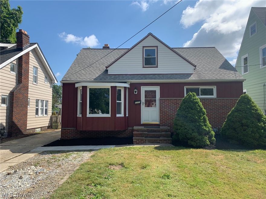 Completely updated brick Bungalow w/full basement.  New Kitchen cabinets and counter tops.  Freshly painted and new vinyl flooring throughout.  New deck and a 1 car detached garage.