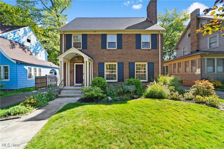 Welcome to this charming brick colonial in the heart of University Heights! With 4 bedrooms and 2.5 bathrooms, this home is full of warmth and character while offering the updates needed for today's comforts and wants. The bedrooms are all of ample size, giving everyone comfortable personal space. The bright and spacious eat-in kitchen has plenty of counter space and storage, blending 1930s leaded glass shelving with modern touches like granite countertops and an induction stove. Hardwood floors and beautiful woodwork run throughout the home, creating a cozy backdrop for everyday living. The living room features a wood-burning fireplace, and the primary bedroom even has its own gas fireplace. You will love the easy connection to the outdoors—a three-season room opens to a bluestone patio and a private, fully fenced backyard filled with perennials that attract butterflies. A second-floor porch with turf adds another fun space to enjoy. Downstairs, the finished basement includes a family room with a media alcove, perfect for movie nights. An oversized 2.5-car garage provides plenty of space for cars, bikes, and storage. Recent updates give peace of mind, including a younger roof, newer hot water tank, and a brand-new electrical panel and main service. The location can’t be beat—you can walk to On the Rise Bakery, explore the Shaker Lakes, and are just minutes from the Van Aken Market District and Lee Road shops and restaurants. This is a wonderful home in a welcoming neighborhood that’s ready for its next chapter!