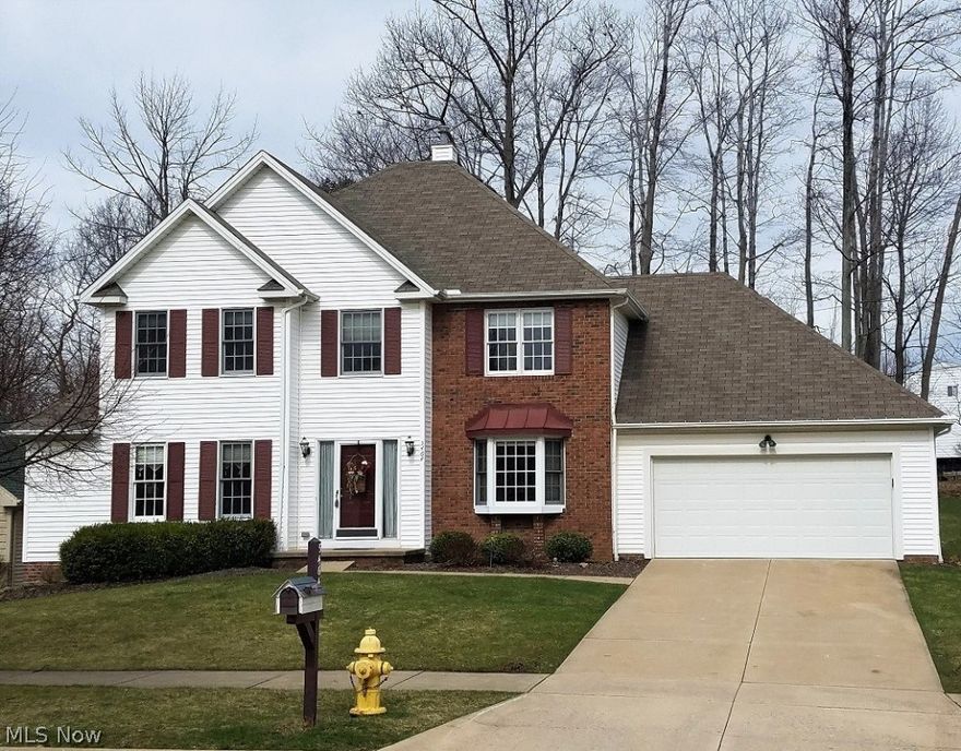 Huntington Reserve! Move right in to this inviting, well cared for home situated on a wooded park like lot! Meticulously maintained inside & out. This incrediable 4 bedroom, 2.5 bath colonial is neutral, open, light and bright! Large eat-in kitchen features a wall of windows with wood laminate floors and large breakfast bar and one of the two walk-in pantries. Off the large inviting entryway you will find an office with french doors that include a large bay window. The formal living room is cozy and can be closed off by a wood glass door. Light and open family room includes a wood burning fireplace. First floor laundry includes a second large walk-in pantry and half bath completes the main level. Open wide stairway includes a skylight window that brings in natural light. The large master bedroom features a walk-in closet and master bath. The finished basement includes glass block windows, guest bedroom and a large storage area. (Feb 2017) - heating replaced. In the summer, spend your e