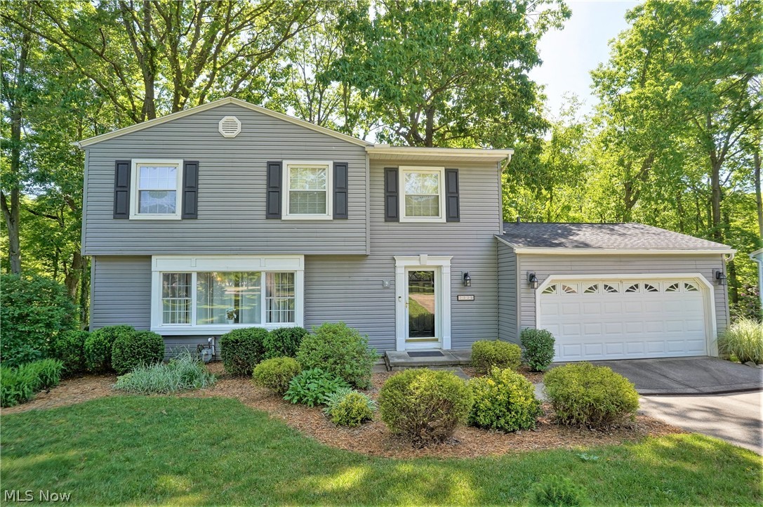 WOW! a true 5 Bedroom Home adjacent Sand Run Park! This value packed home has too many features to mention. Located in a beautiful neighborhood, geographically, convenient to everything in Western Summit County! The back yard is literally a park setting with lush trees in a ravined setting. First Floor boasts Family Room to large Deck, large Formal Dining Room & Spacious Living Room with dramatic picture window. The Eat-In Kitchen features granite counters and plenty of storage. Lower level is a Walk out to park like yard and features family room and 1/2 bath, plus there's an enormous amount of storage in the unfinished areas. All 5 bedrooms are on 2nd floor and there are 2 full baths. The master and front Bedroom have a Jack & Jill Bath, making many possibilities to expand master suite. Updates to the home in the past 14 years include Roof, Siding, granite counters , furnace and central air.