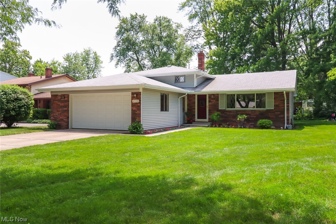 Expansive quad-level split completely clean and ready to move in! Features a nice open-concept design on a beautiful lot in a great location w/ easy access to shopping and highways. Brand new carpeting in the living room, dining room and upper stairs and hall. Loads of new paint throughout including freshly painted extra large 21'X 21' attached garage! Lower level family room w/ walk-out feature is ready for your personal touches w/ a very spacious utility room w/ extra 1/2 bath! This original one-owner home has been lovingly cared for since it was built. A pre-listing home inspection has also been completed for your review!