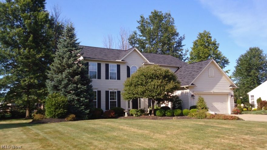 Quality radiates in every nuance of this Sheffield Village home. Two story foyer sparkles under wrought iron chandelier. Hardwood flooring on 1st floor laid in unique Herringbone design. Formal Living Rm & Dining Rm divided by columned archway. A truly custom built kitchen! Country French raised panel cabinets, geometric handles and pulls, slow close cabinets and drawers, beveled edge Corian counters, glass & stone back splash, extra deep under counter stainless sink, Limestone vent hood tops the 36" Stainless Bertazzoni Commercial 5 burner stove, pantry, lighted glass front hutch. Recessed and under cabinet lighting casts a romantic glow throughout this spectacular kitchen. Decorative cornices on fireplace and crown molding add architectural interest to family room. Floor to ceiling bookcases.  Cozy study off the family room is ideal for office or playroom. New carpet just installed August 6! Entire interior freshly painted. Master suite has 10x10 walk in closet with organizers and sh
